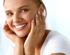 Close-up portrait of woman with straight, bright white teeth