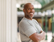 confident, smiling man with dental implants in Framingham