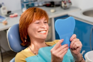 Regain your youthful appearance with dental implants.