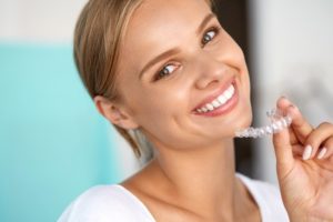 Woman smiling with Invisalign.