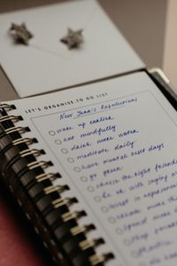 List of New Years resolutions in notebook 